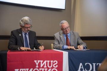 Presidents from Utica University and SUNY Oneonta sign an Articulation Agreement on January 24, 2024.