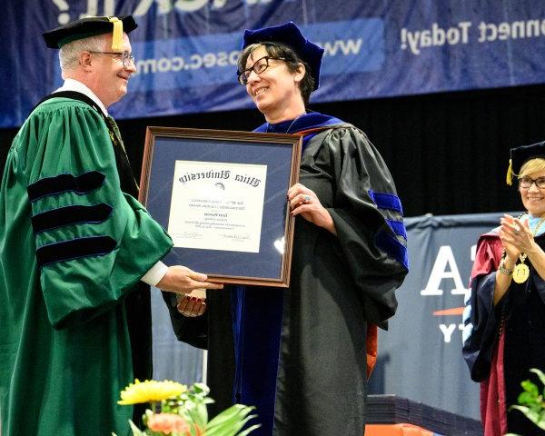Terri Provost receives the Crisafulli Distinguished Teaching Award during the 2022 Undergraduate Commencement Ceremony.